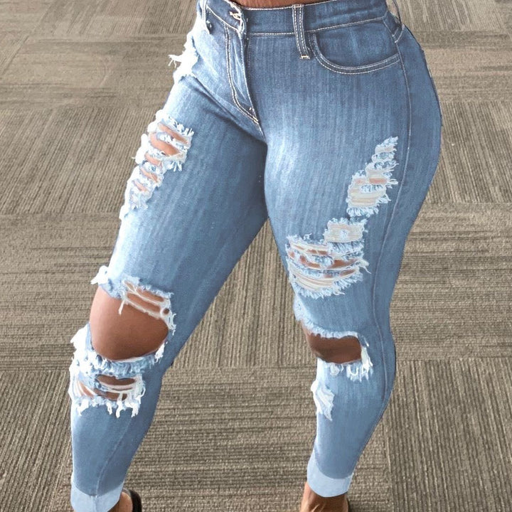 Light jeans with holes